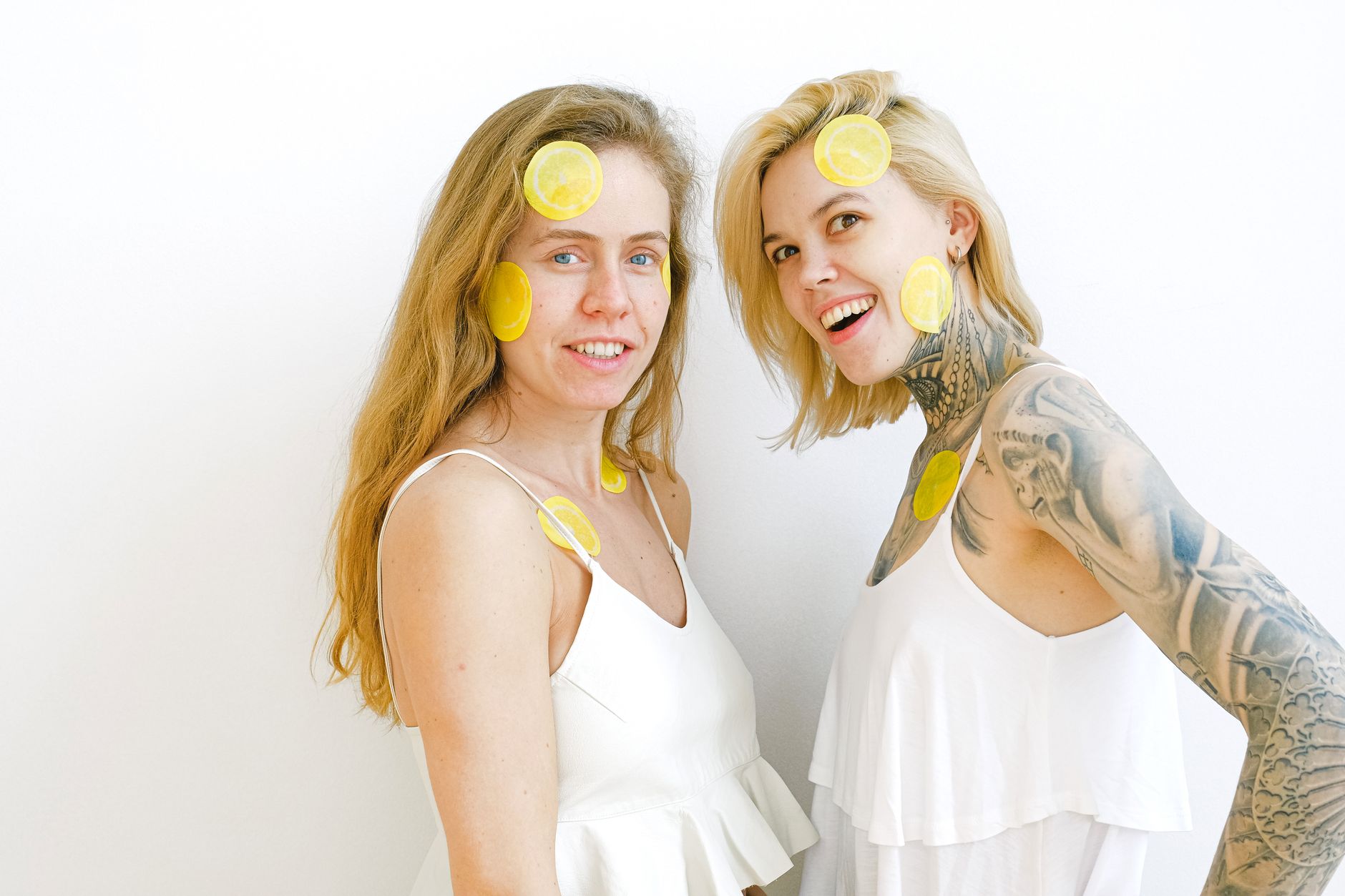 Two women smiling and laughing together, representing emotional connection and intimacy