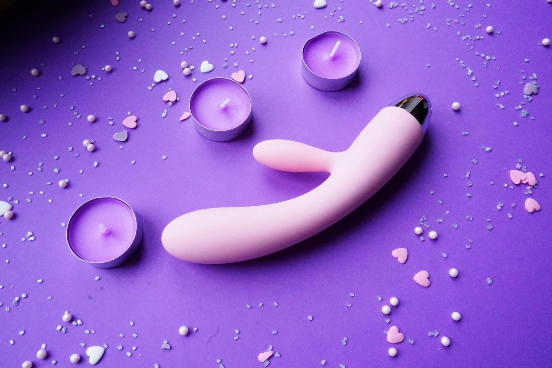 A couple standing together holding a blue vibrator, symbolizing shared intimacy and modern relationship reconnection