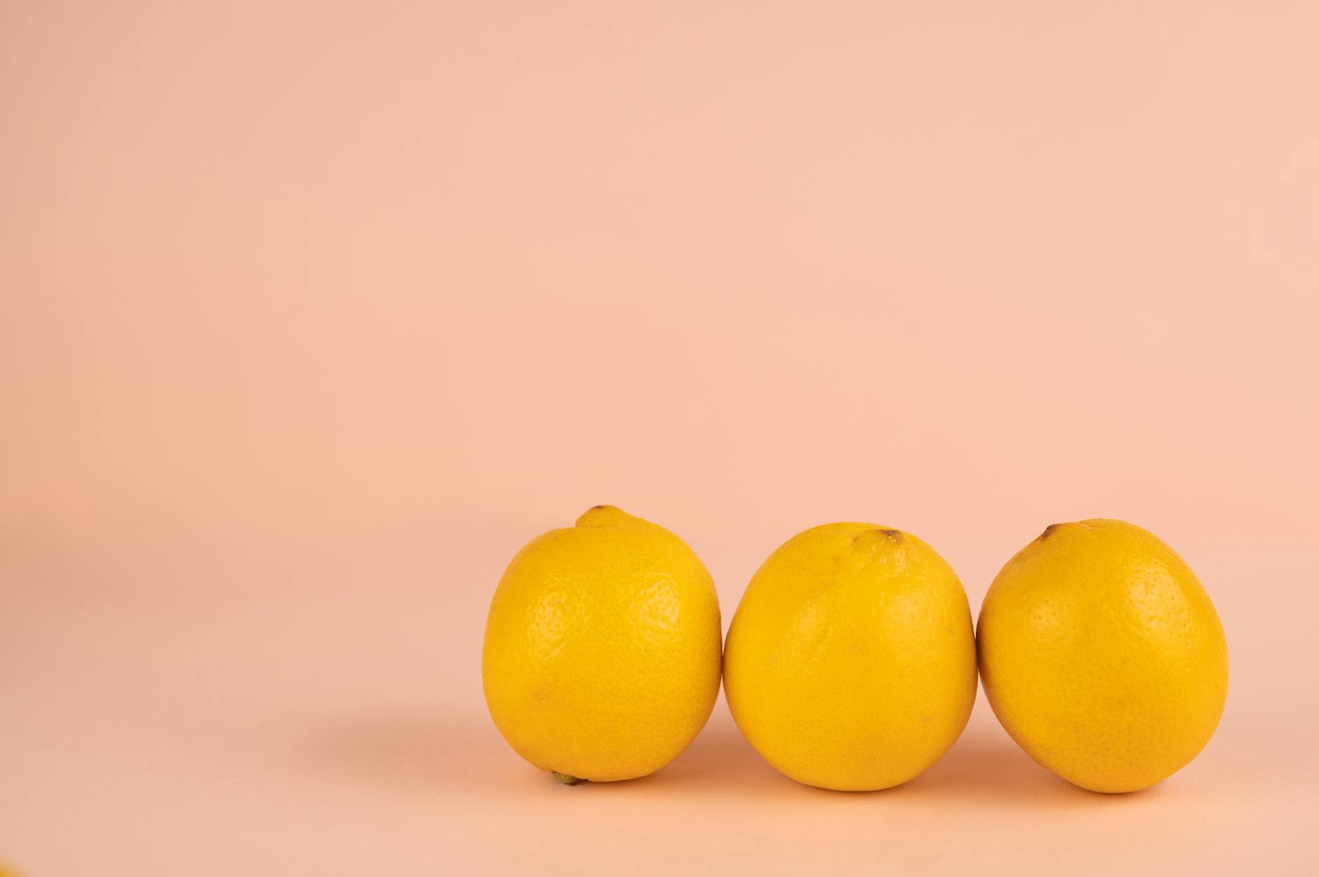 Bright ripe lemons arranged on a pastel background representing fresh perspectives on aging arousal