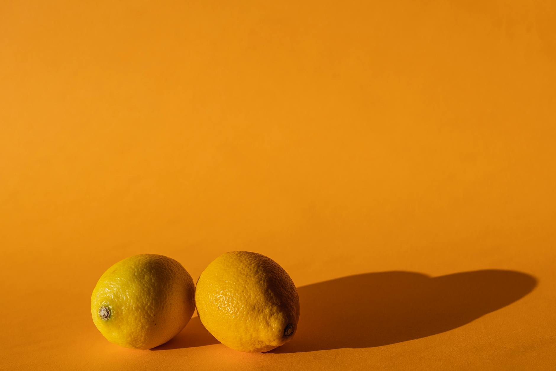 Ripe lemons on a bright yellow background symbolizing renewed vitality and arousal recovery